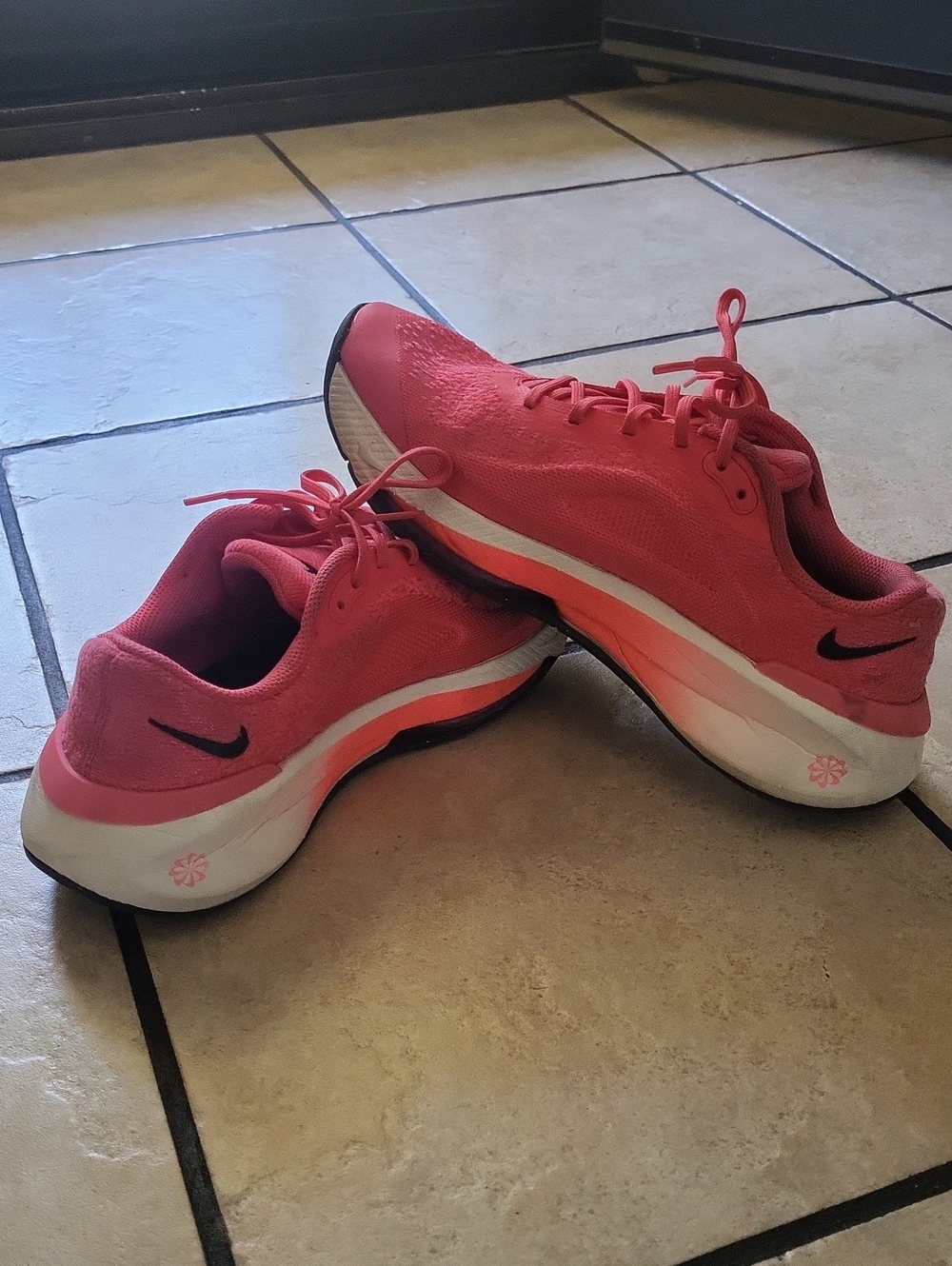 Nike Women’s Coral Pink Athletic Running Shoes with Black Swoosh
